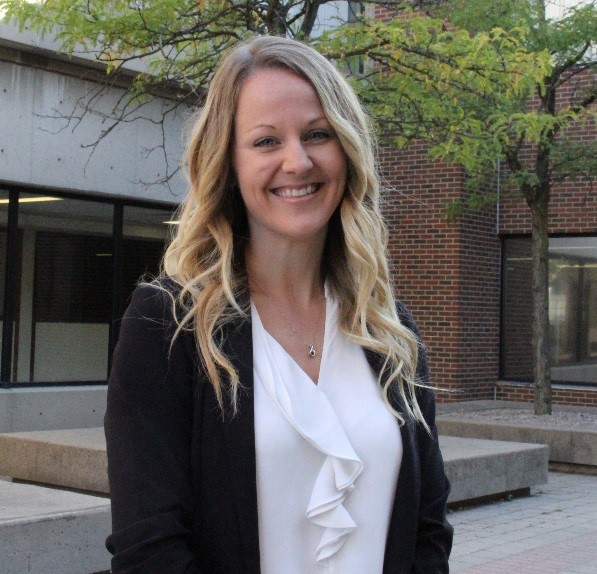 Jaclyn Hurley smiling at camera in an outdoor setting.